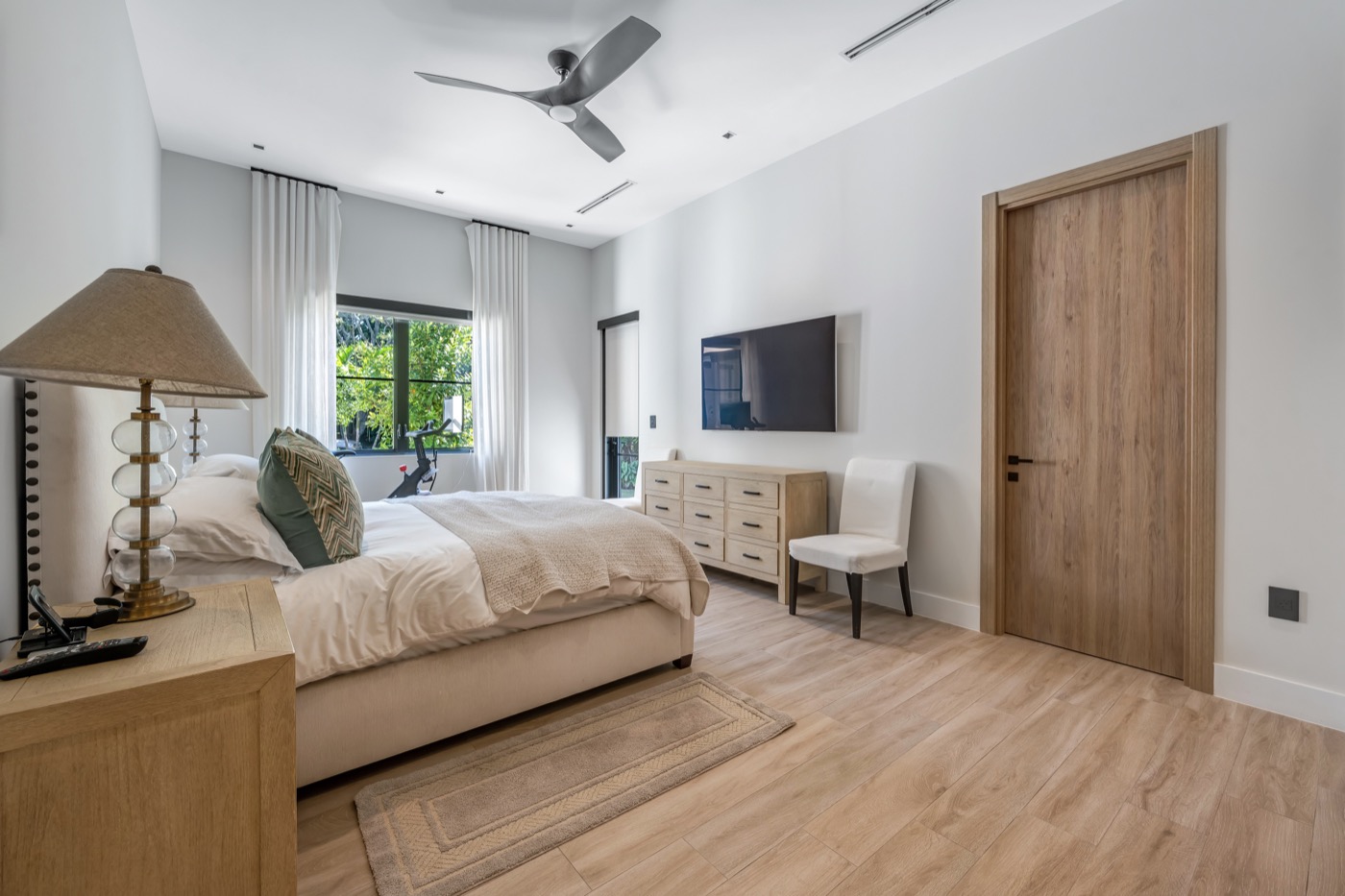 Primary bedroom with natural light, Miami-Dade Residence